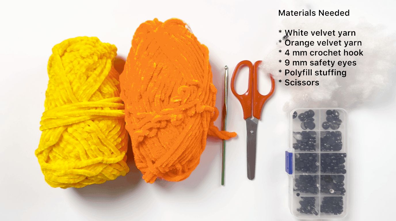 All materials needed for the beginner crochet duck pattern laid out on a white surface, including yellow and orange yarn, a 4mm hook, scissors, and safety eyes.