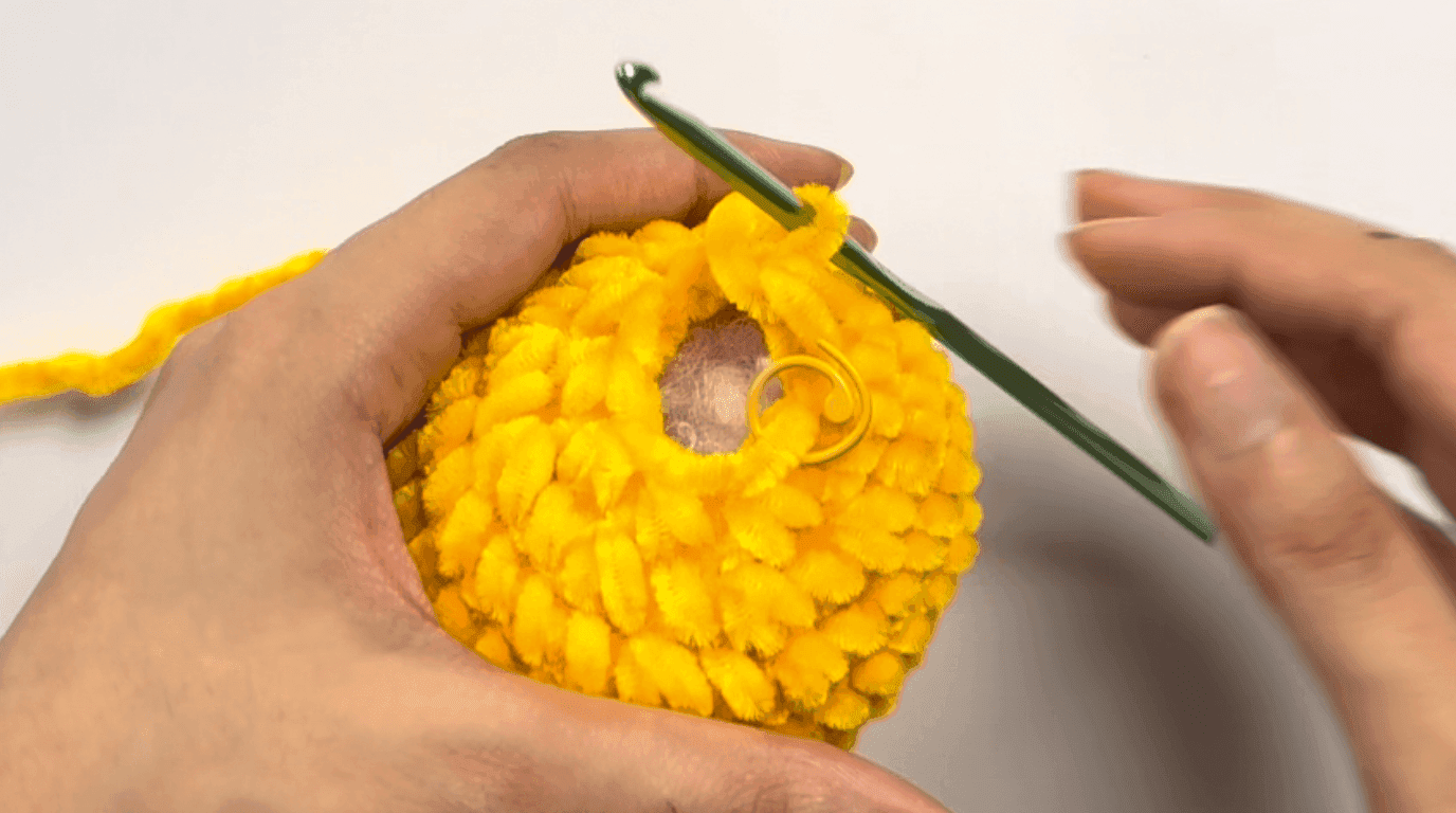 Photos showing round 17 of the crochet duck pattern with the final decreases closing the head opening completely, ready for the yarn tail to be threaded and pulled tight.
