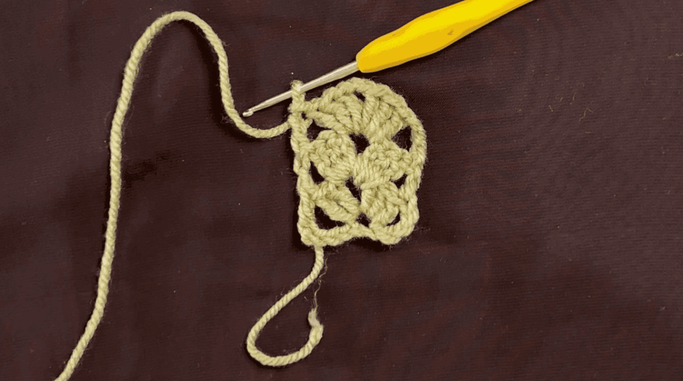 Small granny stripe crochet swatch showing rows 3, repeated to build the bookmark to desired length