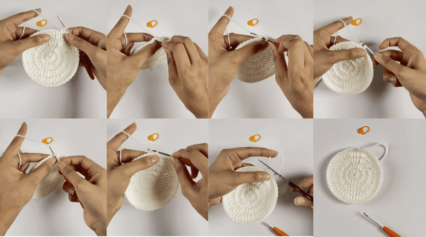 Crochet sunflower coaster closing technique: hands demonstrating slip stitch into first stitch to join and secure completed round with cream yarn